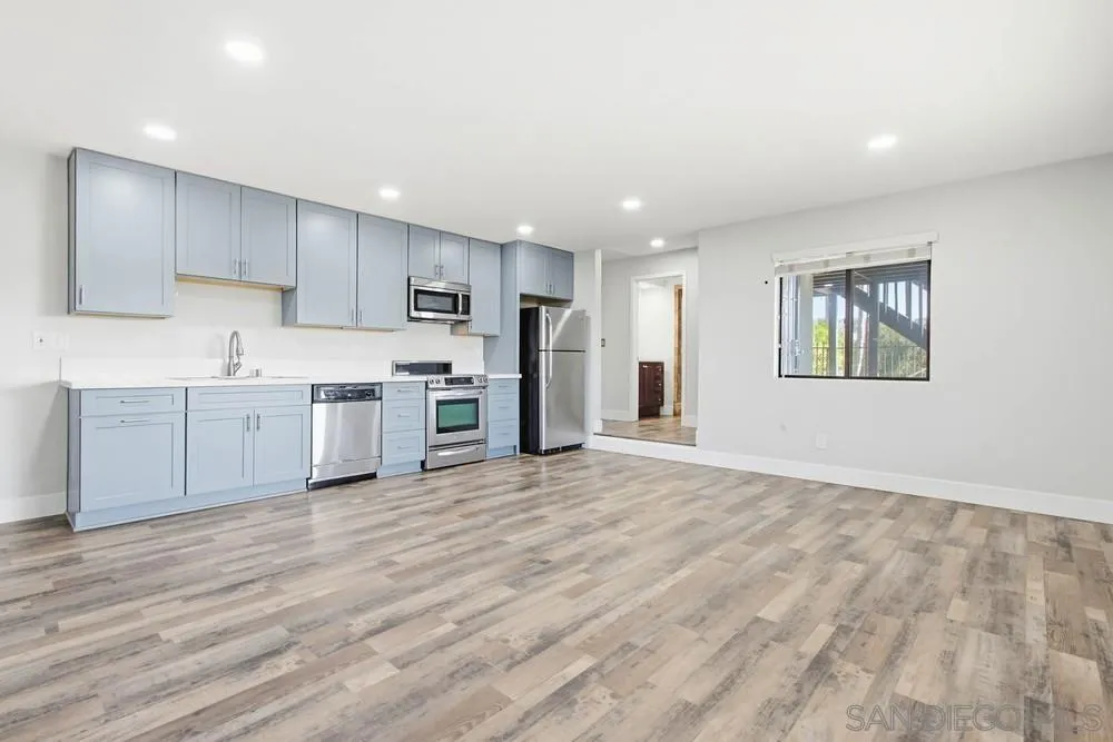 25147 Jack Rabbit Acres, Unit 2 Escondido, CA 92026 - Photo 9 of 39 a view of kitchen with wooden floor and electronic appliances