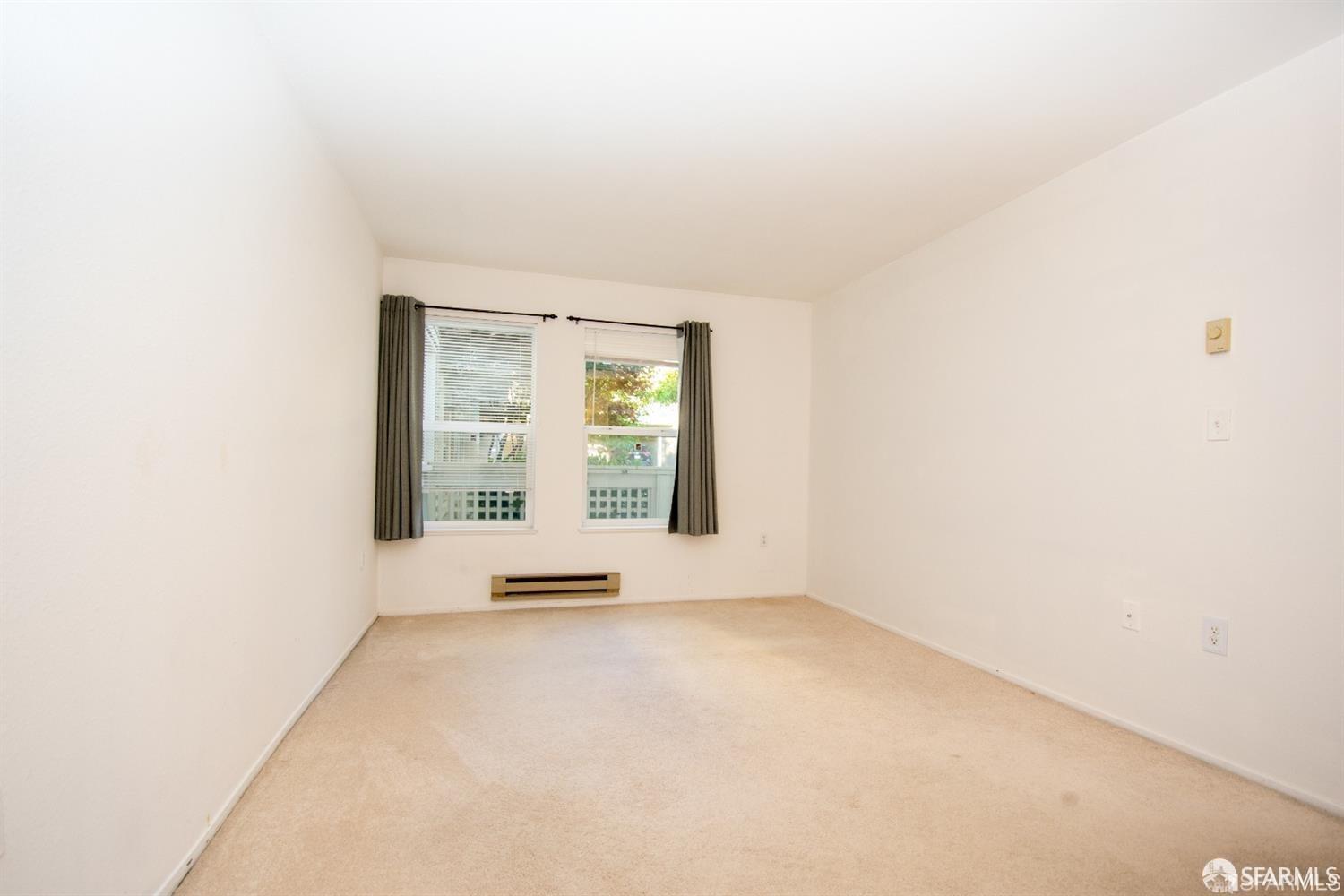2225 23rd Street, Unit 111 San Francisco, CA 94107 - Photo 12 of 18 an empty room with windows