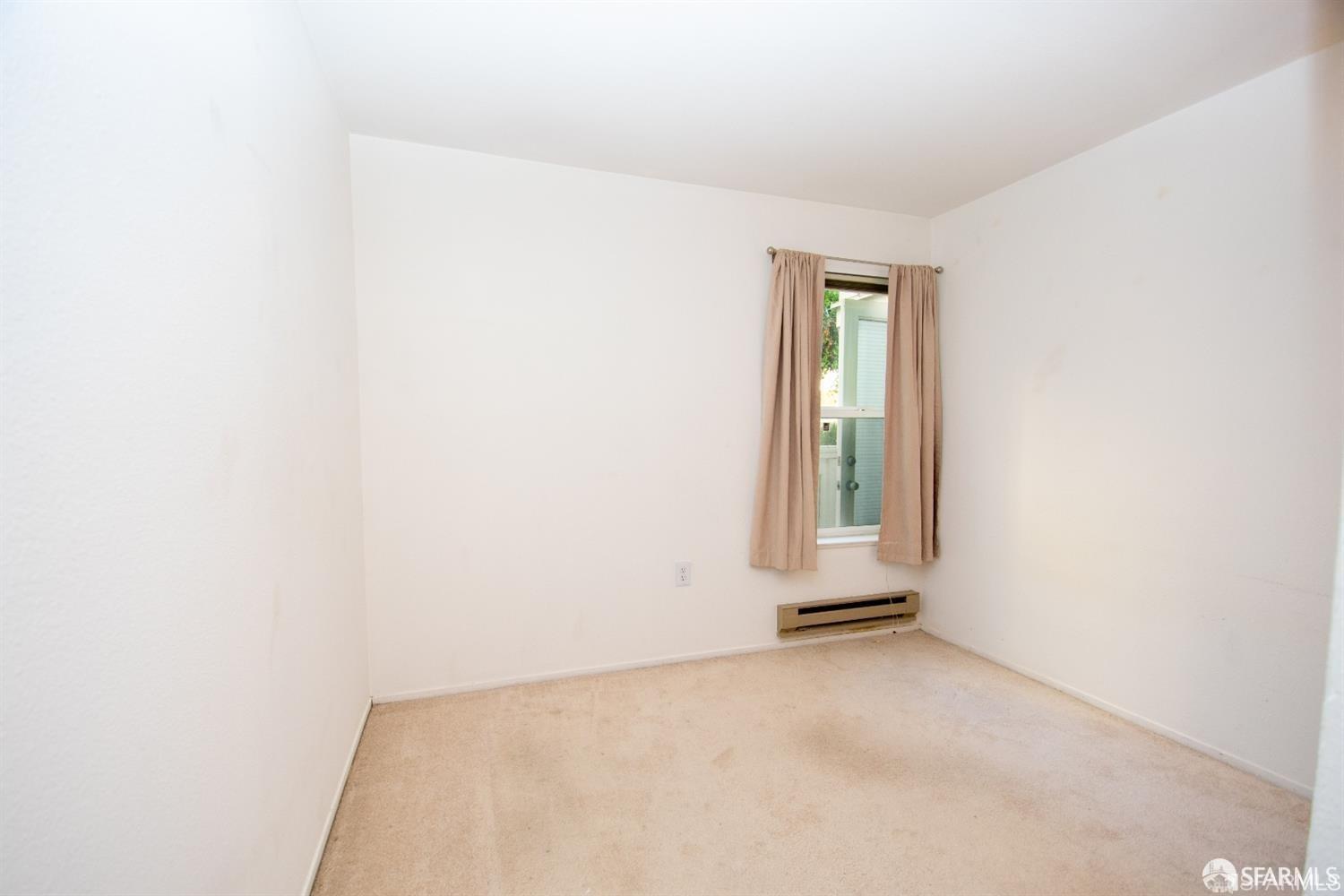2225 23rd Street, Unit 111 San Francisco, CA 94107 - Photo 13 of 18 a view of an empty room with a window