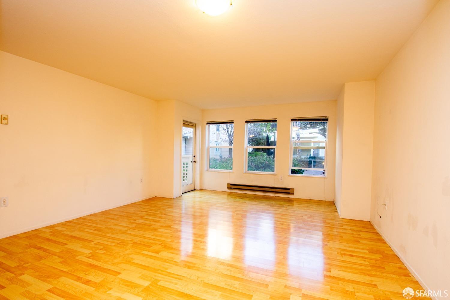 2225 23rd Street, Unit 111 San Francisco, CA 94107 - Photo 6 of 18 a view of an empty room with a window