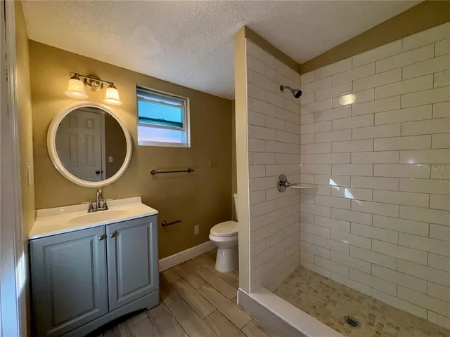 a bathroom with a sink and mirror