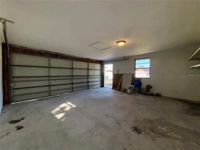 a view of a room with stairs and white walls