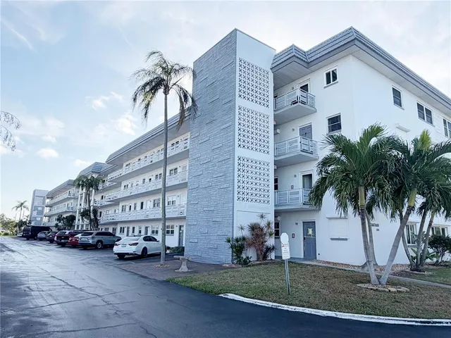 a living room with furniture a window and a table