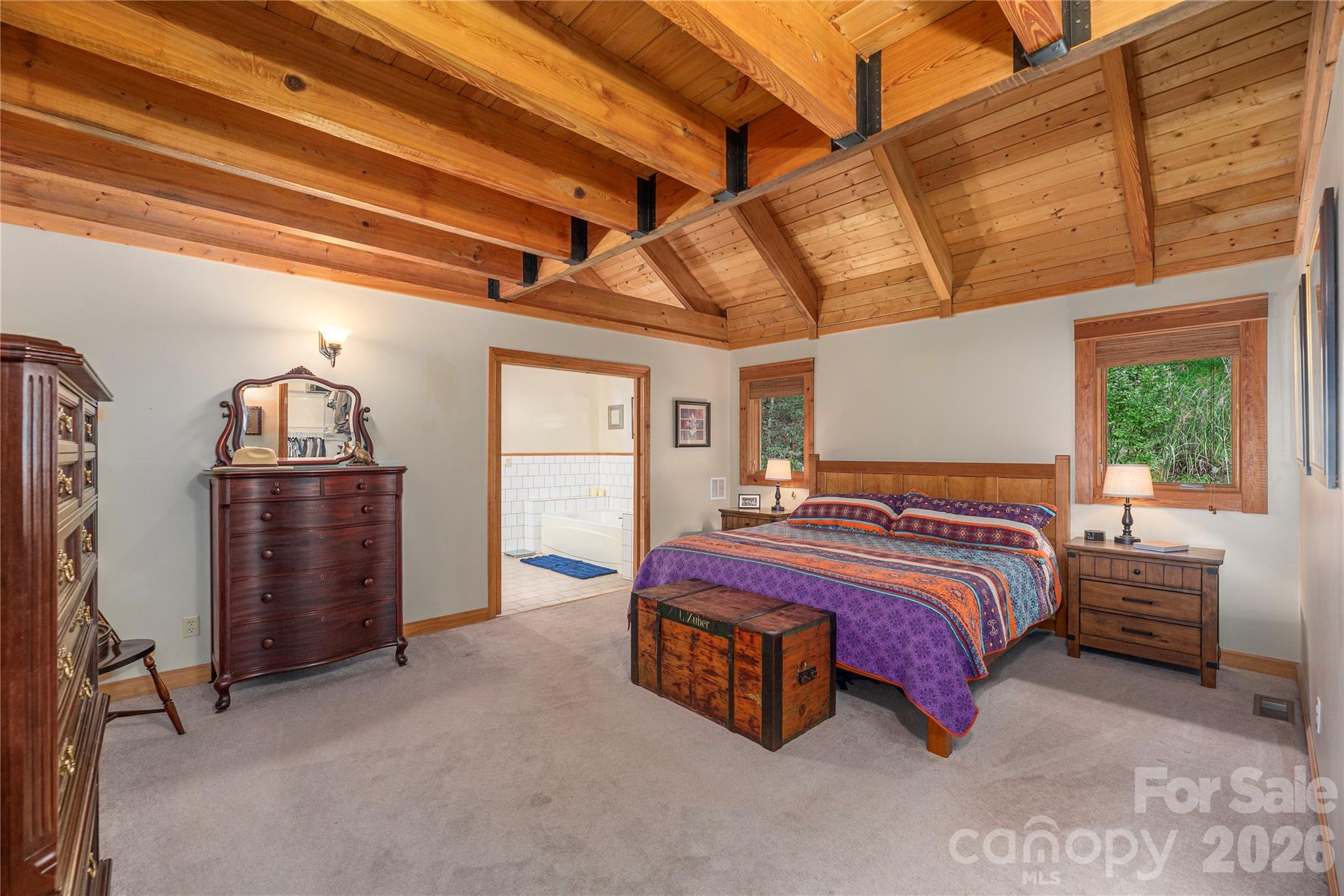 116 Ivy Road Mills River, NC 28759 - Photo 16 of 45 a spacious bedroom with a bed and a window
