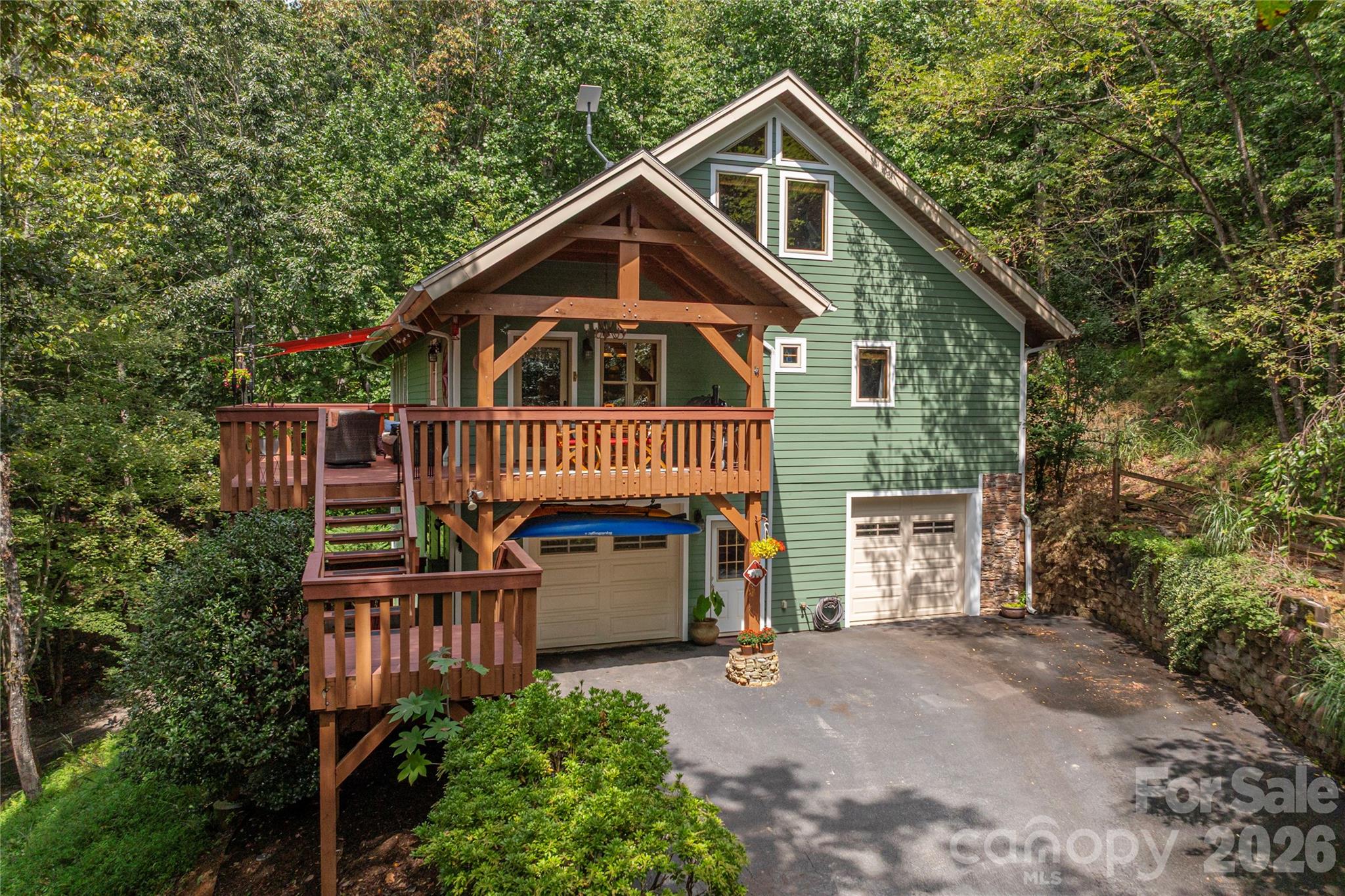 116 Ivy Road Mills River, NC 28759 - Photo 2 of 45 a front view of a house with garden