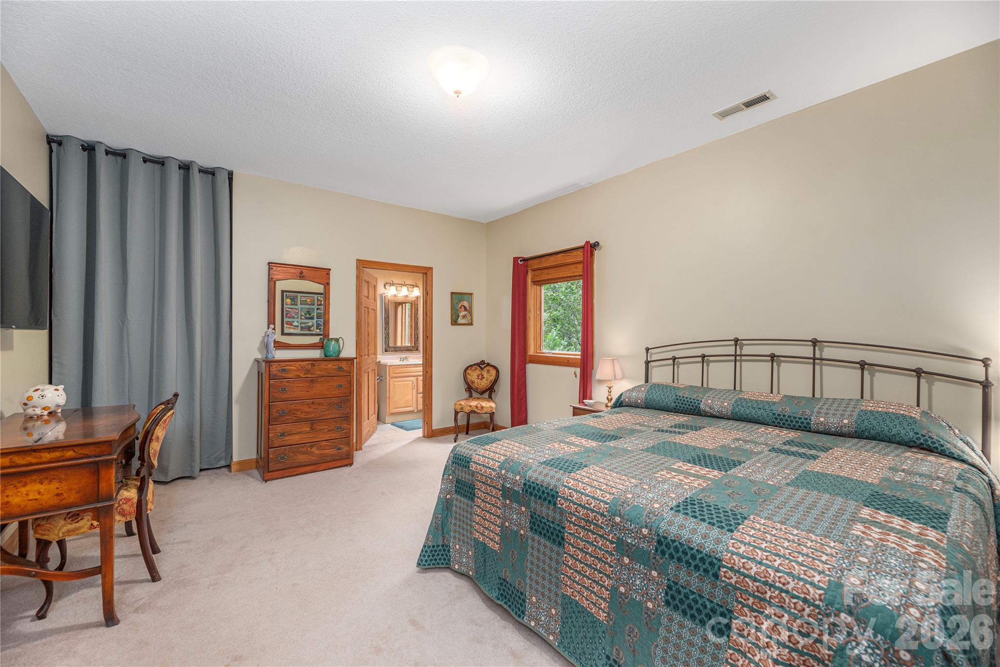 116 Ivy Road Mills River, NC 28759 - Photo 31 of 45 a bedroom with a bed and a dresser in it