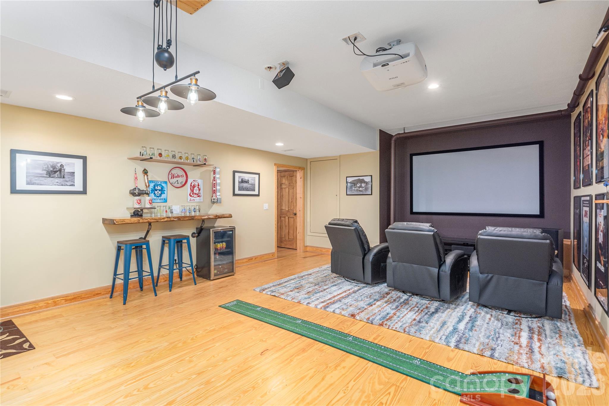 116 Ivy Road Mills River, NC 28759 - Photo 35 of 45 a living room with furniture a flat screen tv and a dining table