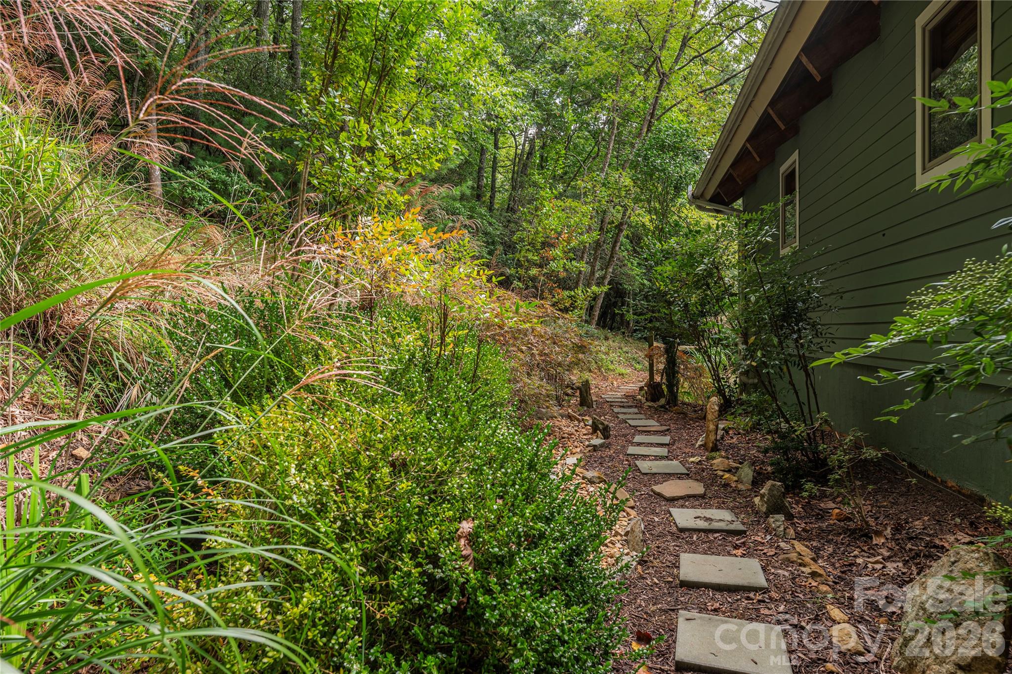 116 Ivy Road Mills River, NC 28759 - Photo 39 of 45 a view of a yard with plants and large trees
