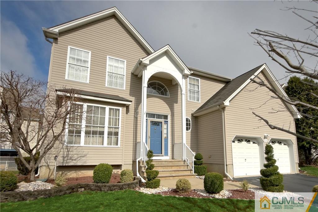 13 Timber Ridge Road North Brunswick, NJ 08902 - Photo 2 of 24 a front view of a house with garden
