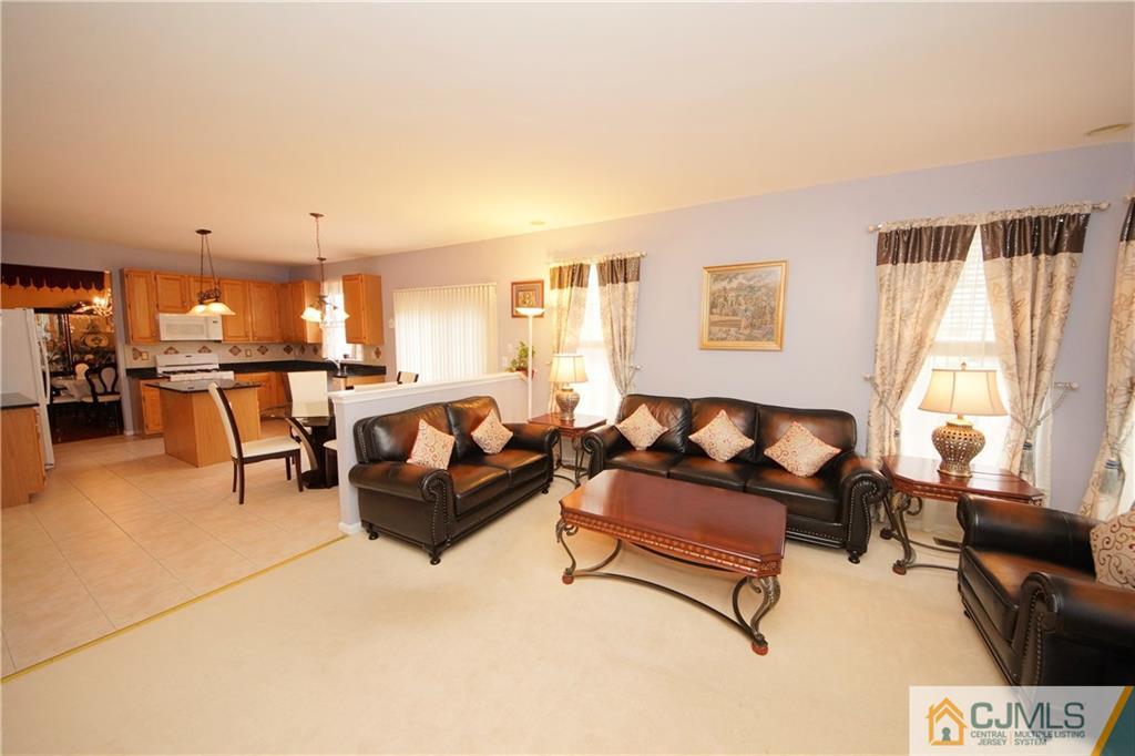 13 Timber Ridge Road North Brunswick, NJ 08902 - Photo 13 of 24 a living room with furniture and a large window