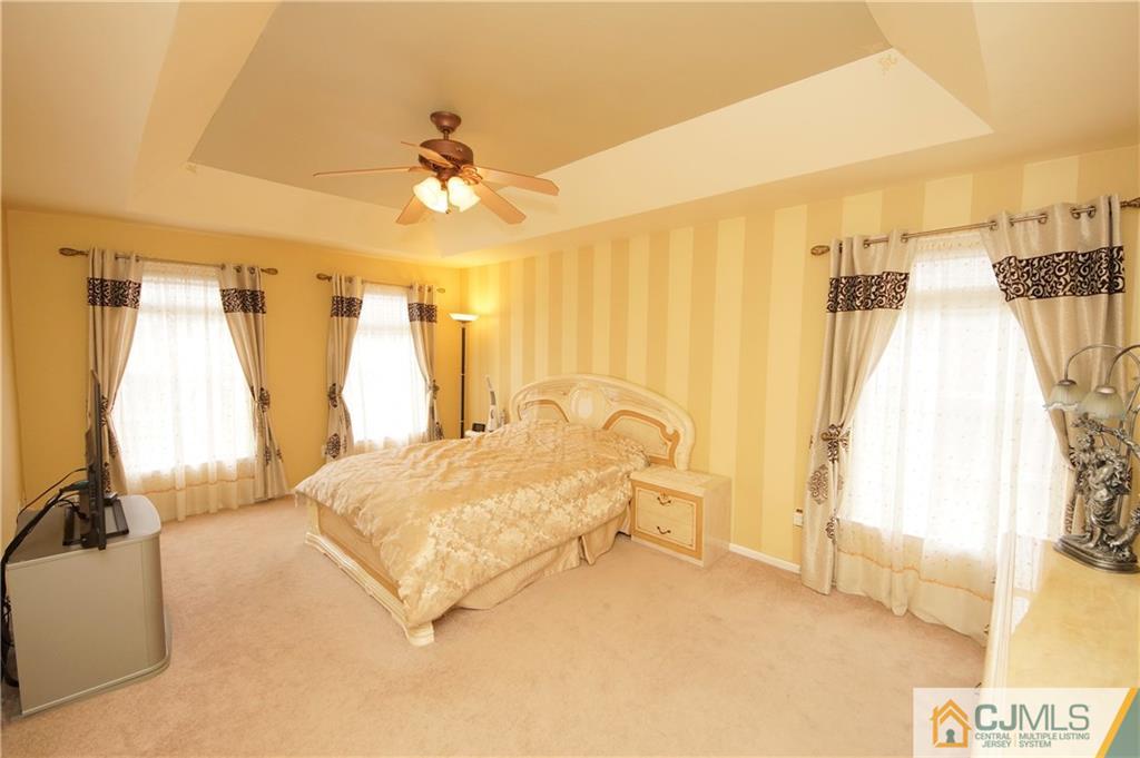 13 Timber Ridge Road North Brunswick, NJ 08902 - Photo 16 of 24 a spacious bedroom with a bed and a window