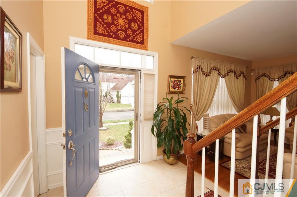 13 Timber Ridge Road North Brunswick, NJ 08902 - Photo 3 of 24 a view of an entryway with wooden floor