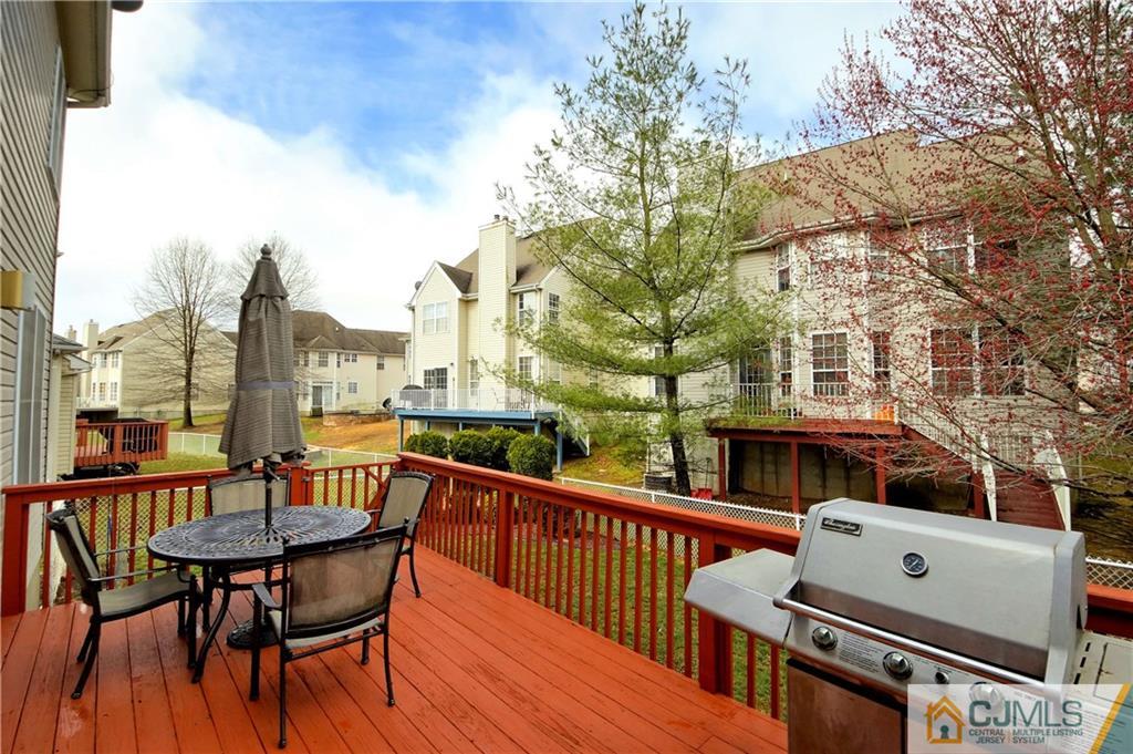 13 Timber Ridge Road North Brunswick, NJ 08902 - Photo 24 of 24 a view of a patio with a table and chairs