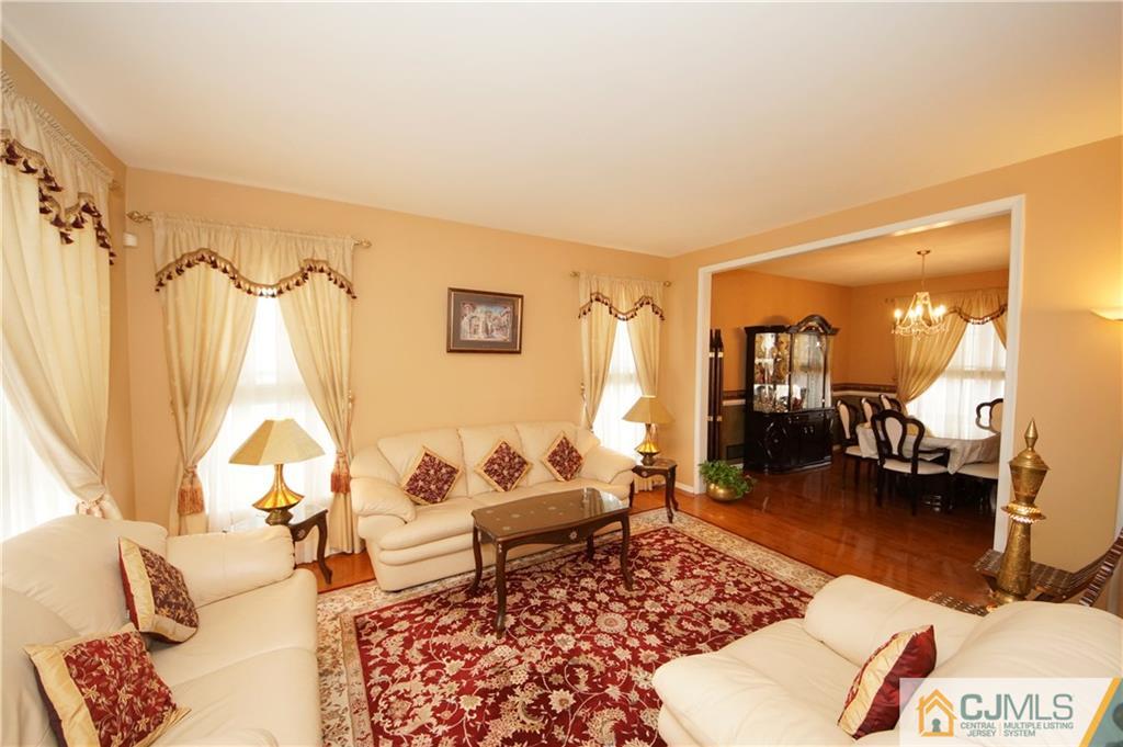 13 Timber Ridge Road North Brunswick, NJ 08902 - Photo 5 of 24 a living room with furniture and a wooden floor