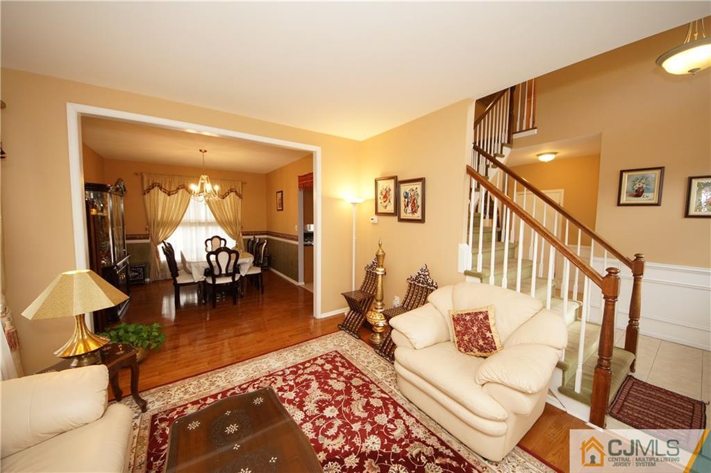 13 Timber Ridge Road North Brunswick, NJ 08902 - Photo 7 of 24 a living room with furniture and wooden floor