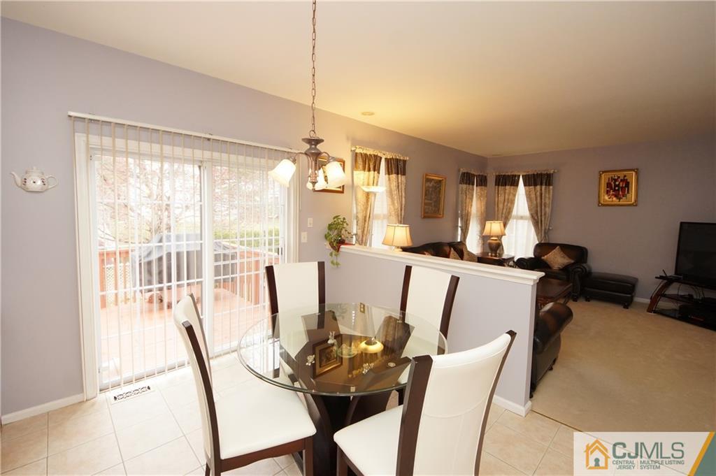 13 Timber Ridge Road North Brunswick, NJ 08902 - Photo 10 of 24 a view of a dining room with furniture window and outside view