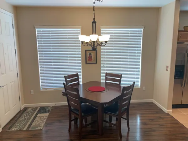 a dining room with furniture and window
