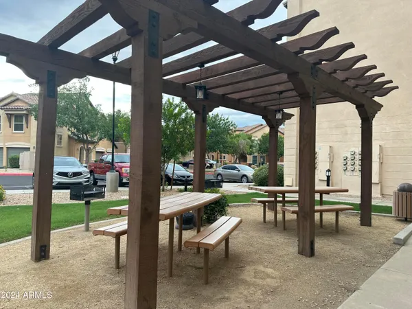 a view of a porch with chairs and backyard