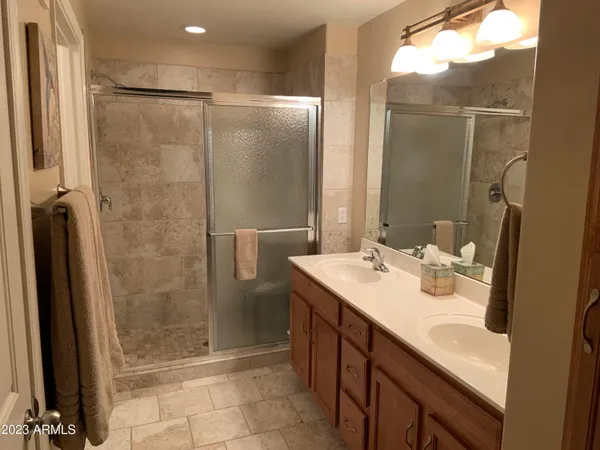 a bathroom with a sink vanity and a mirror