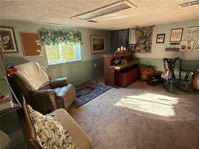 a living room with furniture window and a table