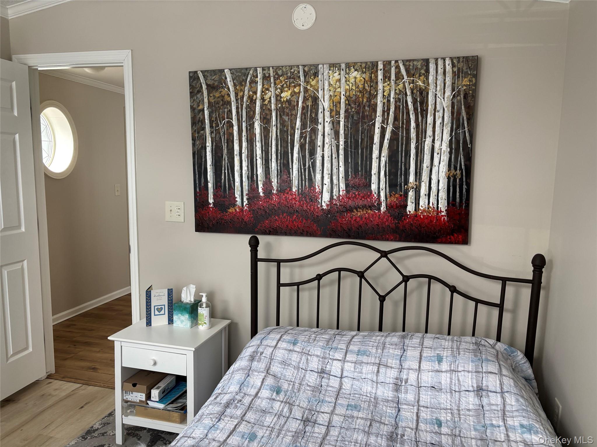 1661 Old Country Road, Unit 69 Riverhead, NY 11901 - Photo 13 of 37 a bedroom with a bed and a window