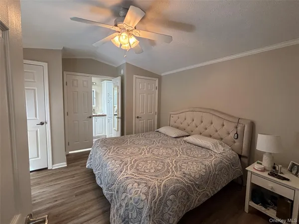 a front view of a house with cars parked