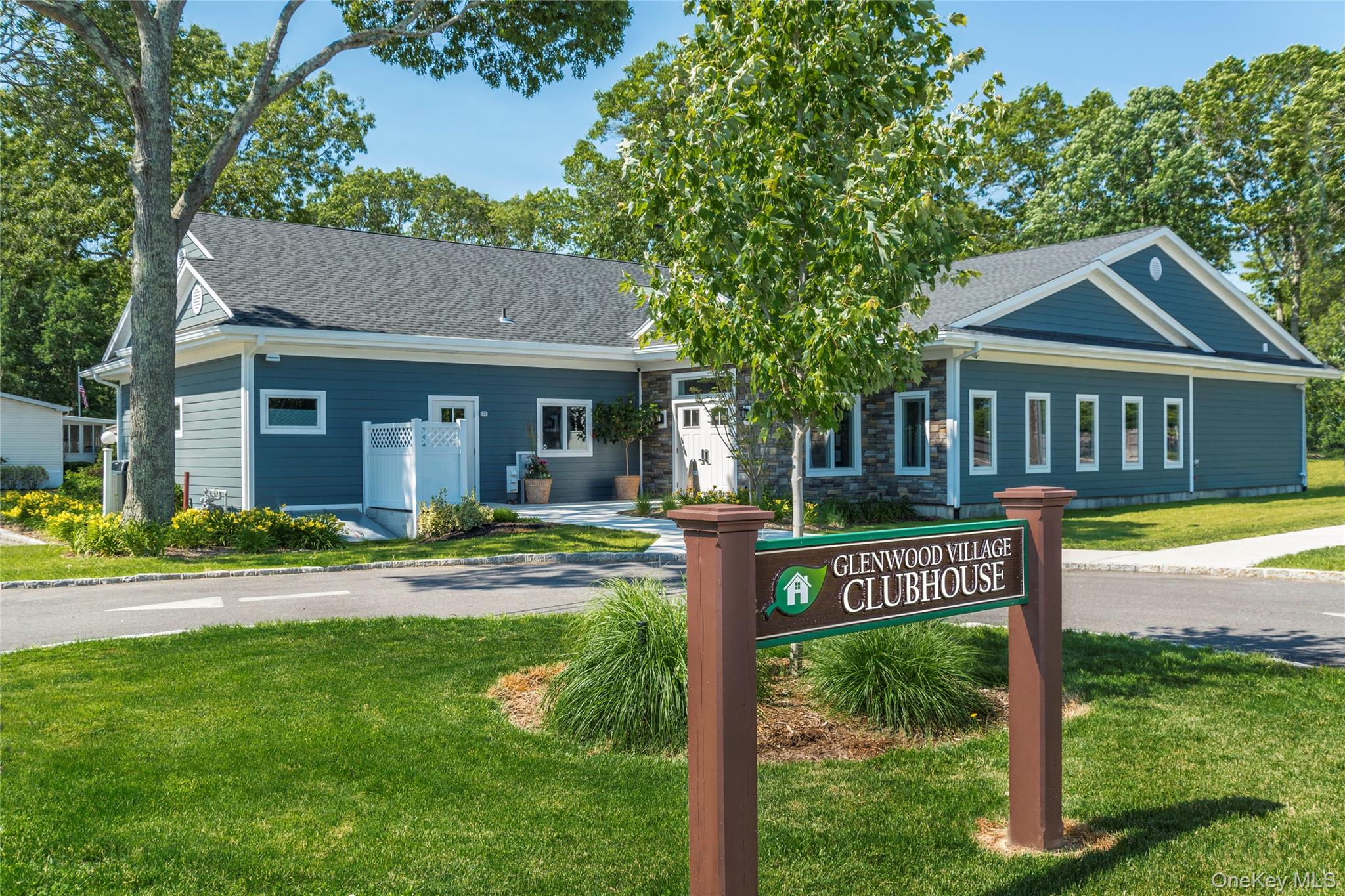 1661 Old Country Road, Unit 69 Riverhead, NY 11901 - Photo 29 of 37 a view of a house with a yard and street