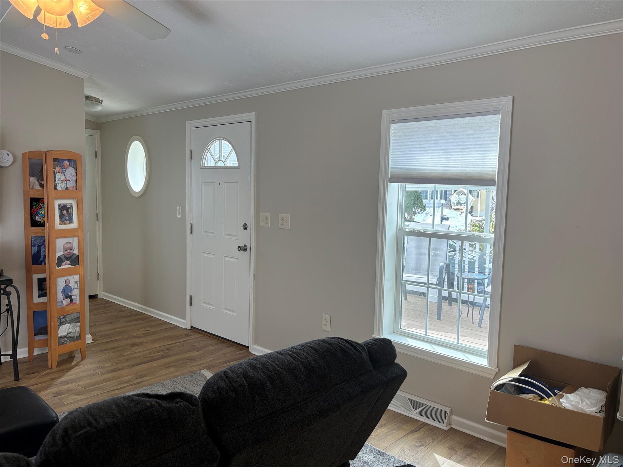 1661 Old Country Road, Unit 69 Riverhead, NY 11901 - Photo 8 of 37 a bedroom with furniture and a window