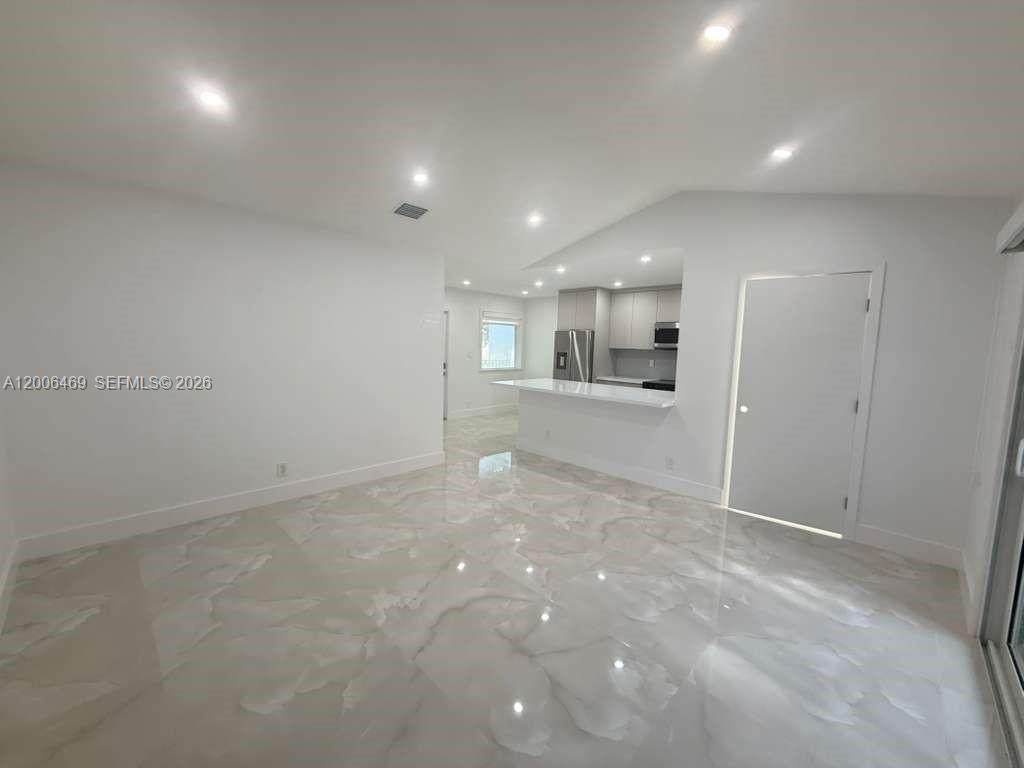 9307 Southwest 138th Place, Unit 9307 Miami, FL 33186 - Photo 5 of 15 a view of a hallway