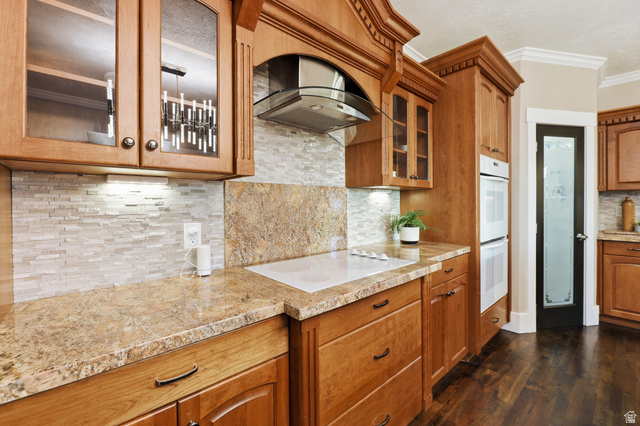 2342 Charros Road Sandy, UT 84092 - Photo 21 of 94 Kitchen featuring wood cabinetry, granite countertops, and a white subway tile backsplash