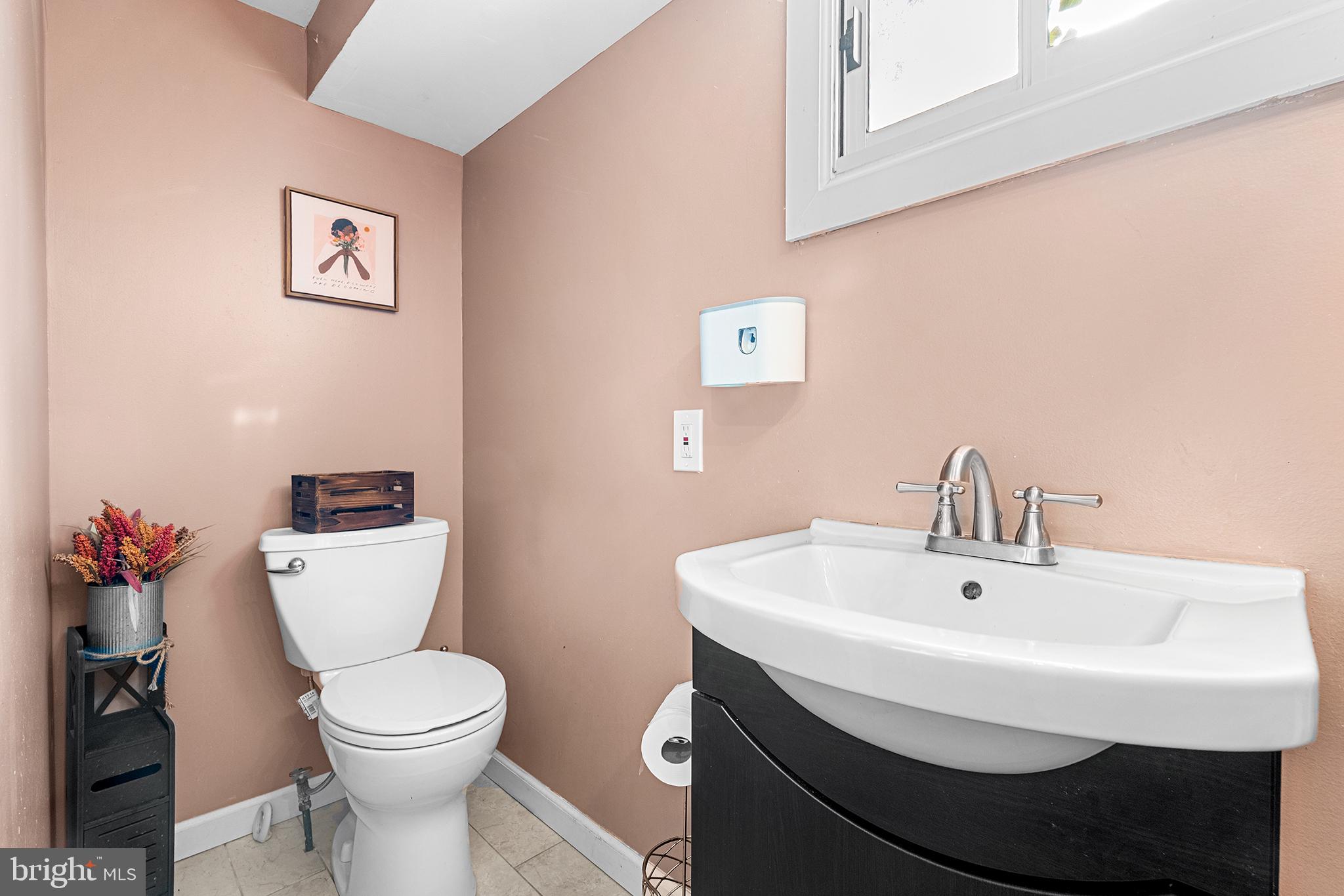 8308 Cobden Road Glenside, PA 19038 - Photo 12 of 29 Chic powder room with modern accents.