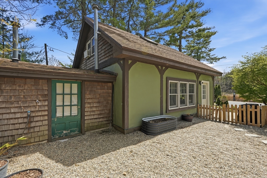 136 Flynt Street Palmer, MA 01069 - Photo 17 of 28 a view of a house with a yard and wooden fence