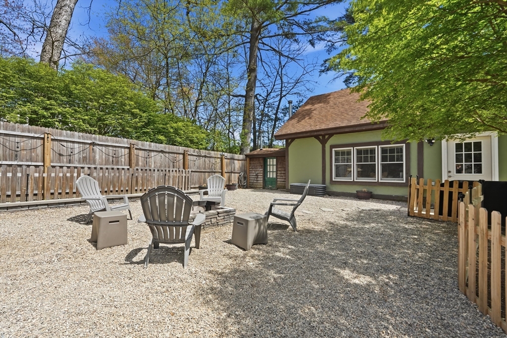 136 Flynt Street Palmer, MA 01069 - Photo 18 of 28 a view of a chair and table in backyard