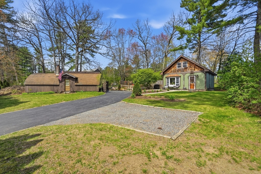 136 Flynt Street Palmer, MA 01069 - Photo 27 of 28 a front view of a house with a yard and garage