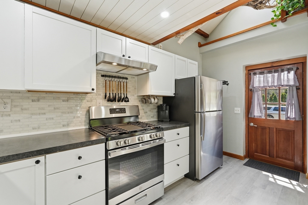 136 Flynt Street Palmer, MA 01069 - Photo 6 of 28 a kitchen with stainless steel appliances granite countertop a stove a refrigerator and a cabinets