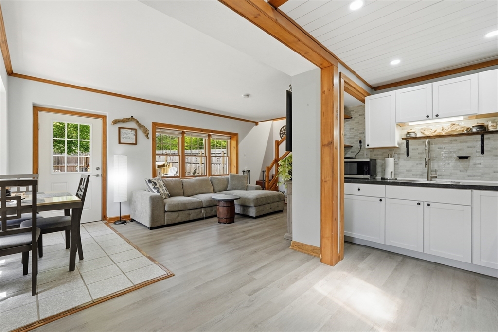 136 Flynt Street Palmer, MA 01069 - Photo 7 of 28 a living room with furniture and a open kitchen view