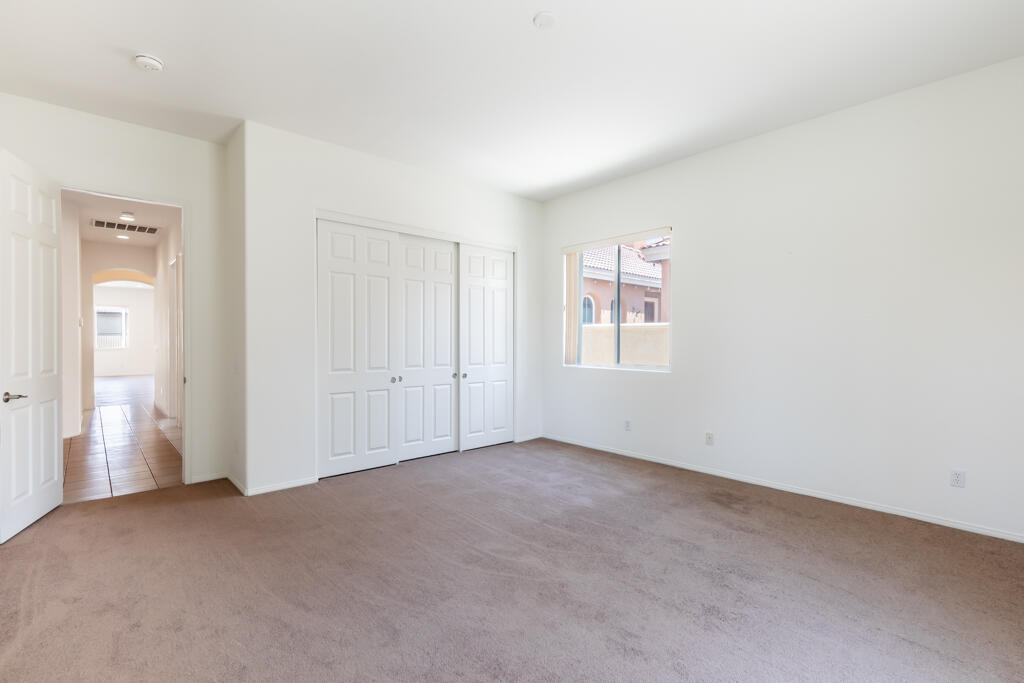 49635 Wayne Street Indio, CA 92201 - Photo 15 of 21 an empty room with windows and closet
