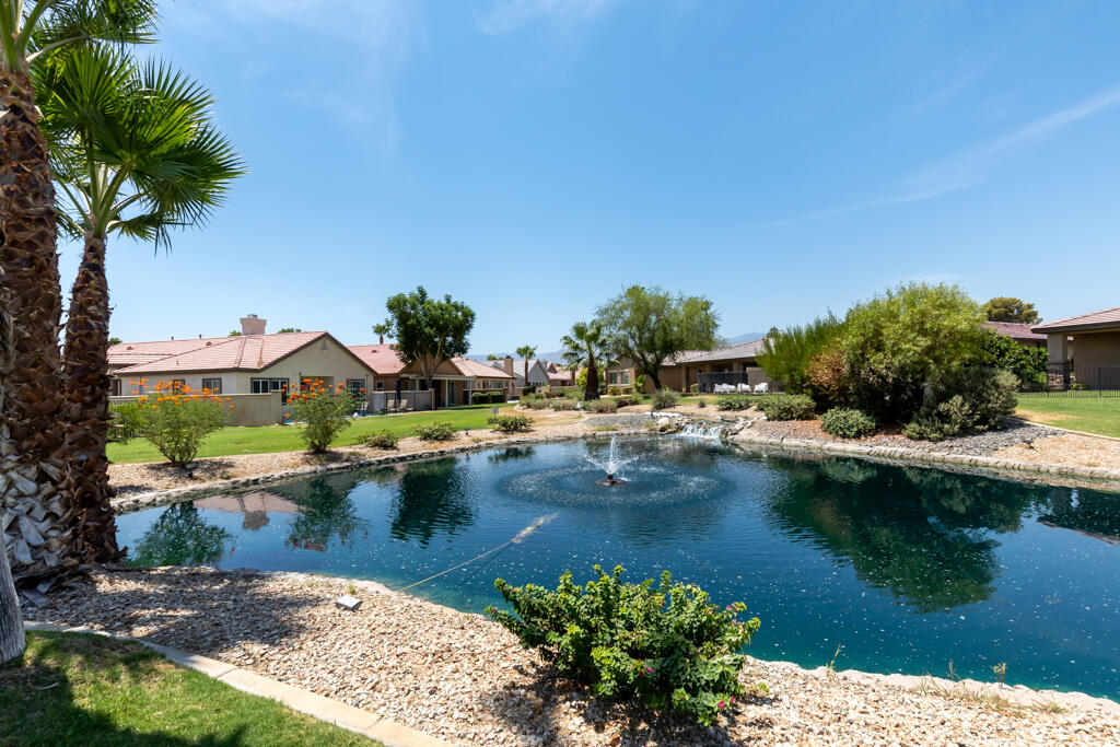 49635 Wayne Street Indio, CA 92201 - Photo 19 of 21 a view of swimming pool with outdoor seating and lake