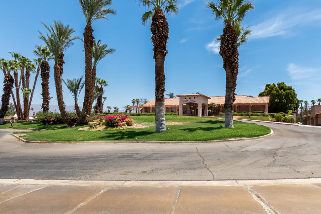 49635 Wayne Street Indio, CA 92201 - Photo 20 of 21 front view of a house with a yard and palm trees
