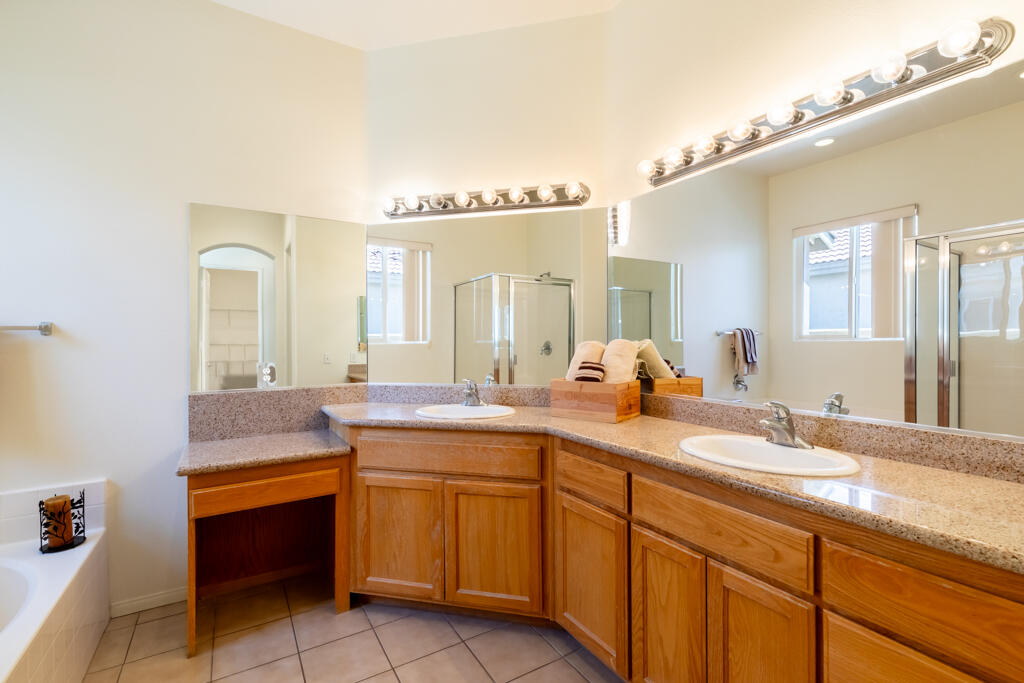 49635 Wayne Street Indio, CA 92201 - Photo 10 of 21 a spacious bathroom with a granite countertop sink mirror and double