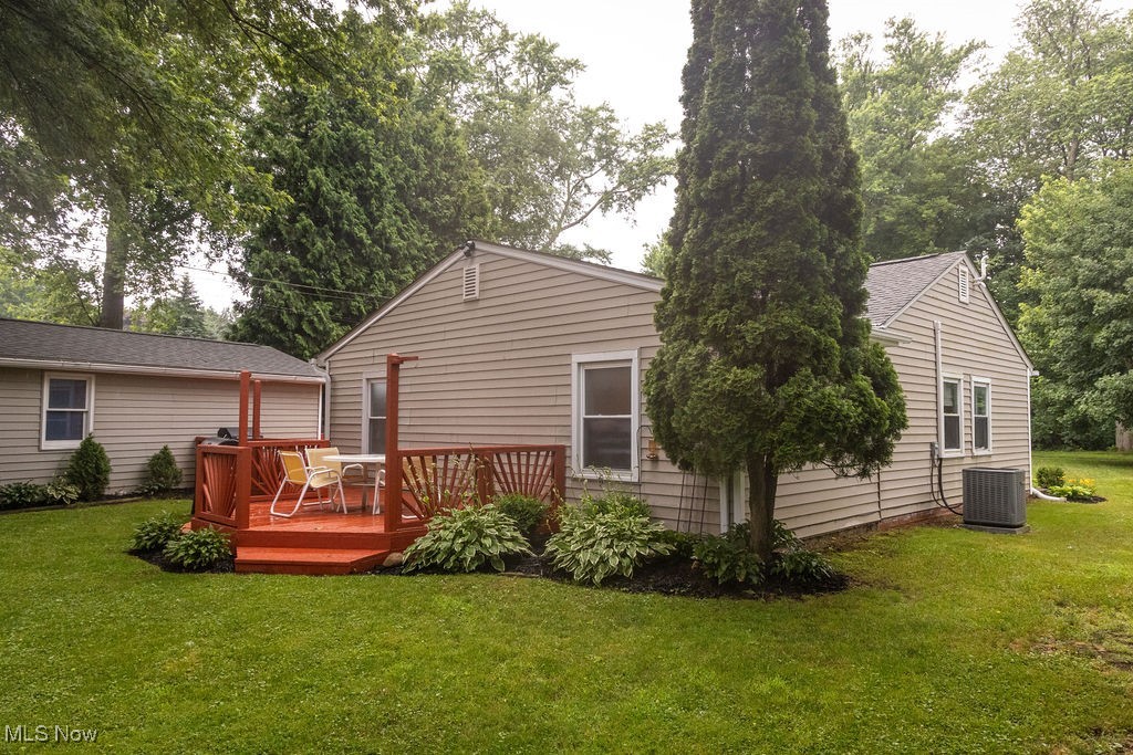 1995 Benjamin Road Madison, OH 44057 - Photo 15 of 50 Back of house with a deck and a yard
