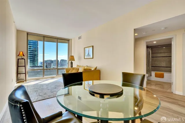 a kitchen with stainless steel appliances granite countertop a sink refrigerator and microwave