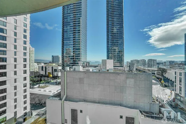 a view of kitchen with furniture and refrigerator