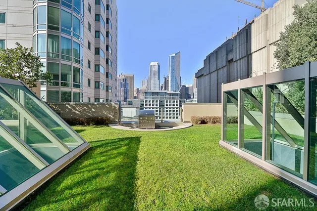 a swimming pool with outdoor seating and yard