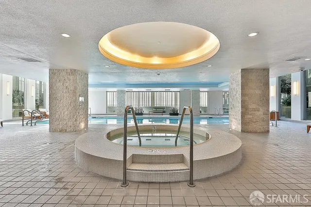 a patio with sofas table and chairs