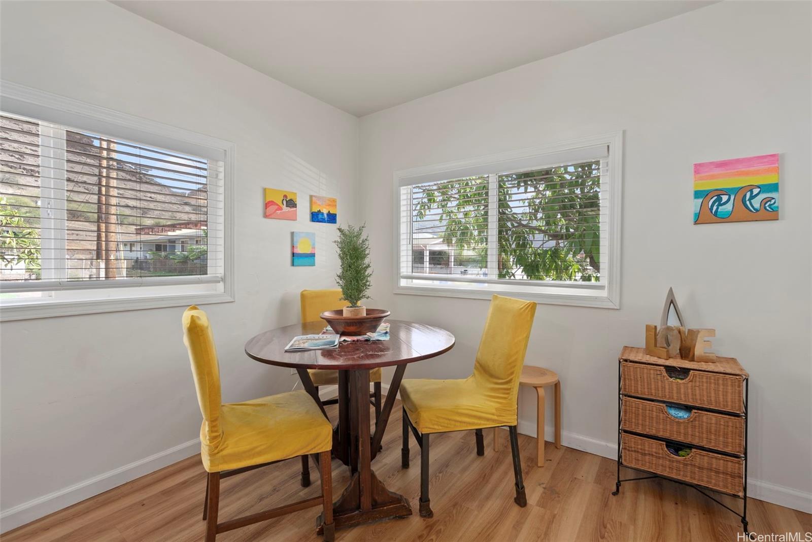 87-1423 Akowai Road Waianae, HI 96792 - Photo 12 of 24 a view of a dining room with furniture and wooden floor