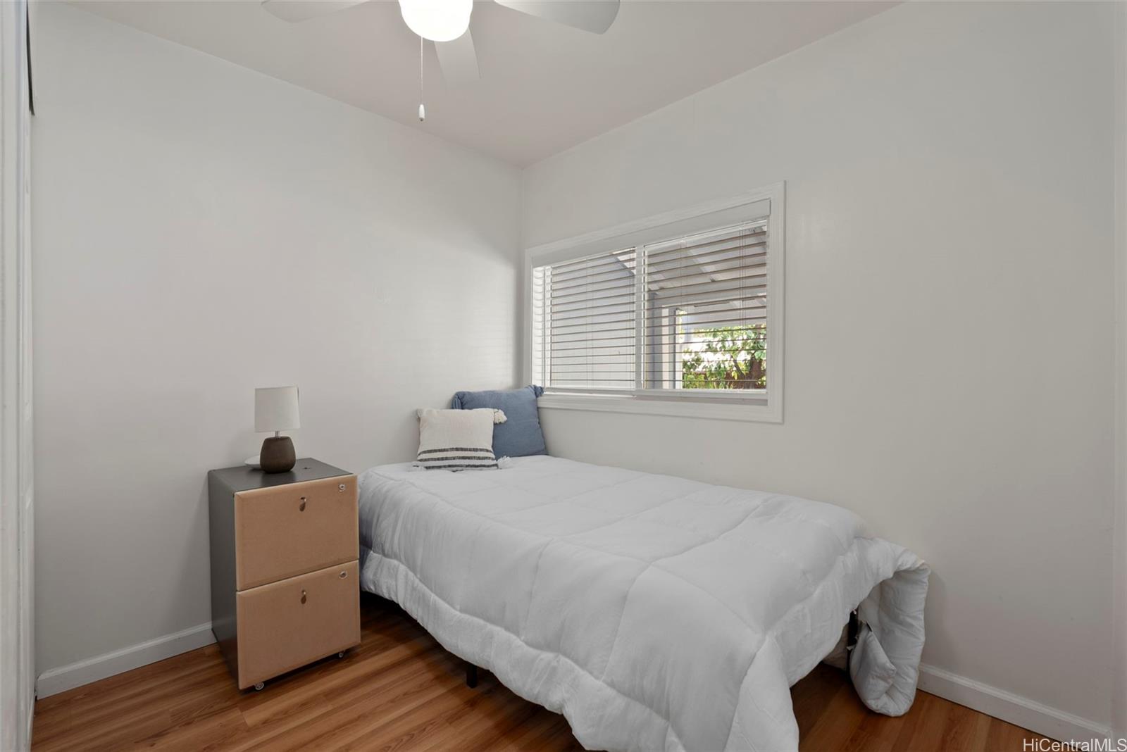 87-1423 Akowai Road Waianae, HI 96792 - Photo 16 of 24 a bedroom with a bed and a window