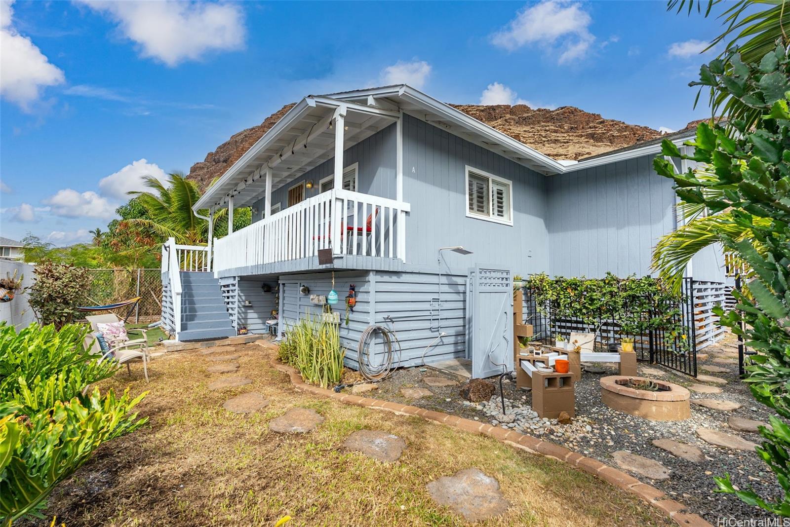 87-1423 Akowai Road Waianae, HI 96792 - Photo 22 of 24 a front view of a house with a garden