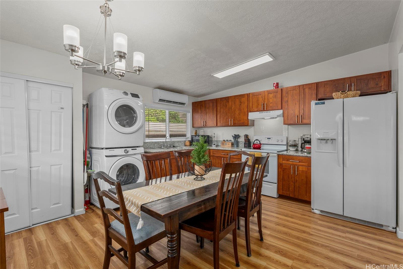 87-1423 Akowai Road Waianae, HI 96792 - Photo 5 of 24 a view of a dining room with furniture and wooden floor