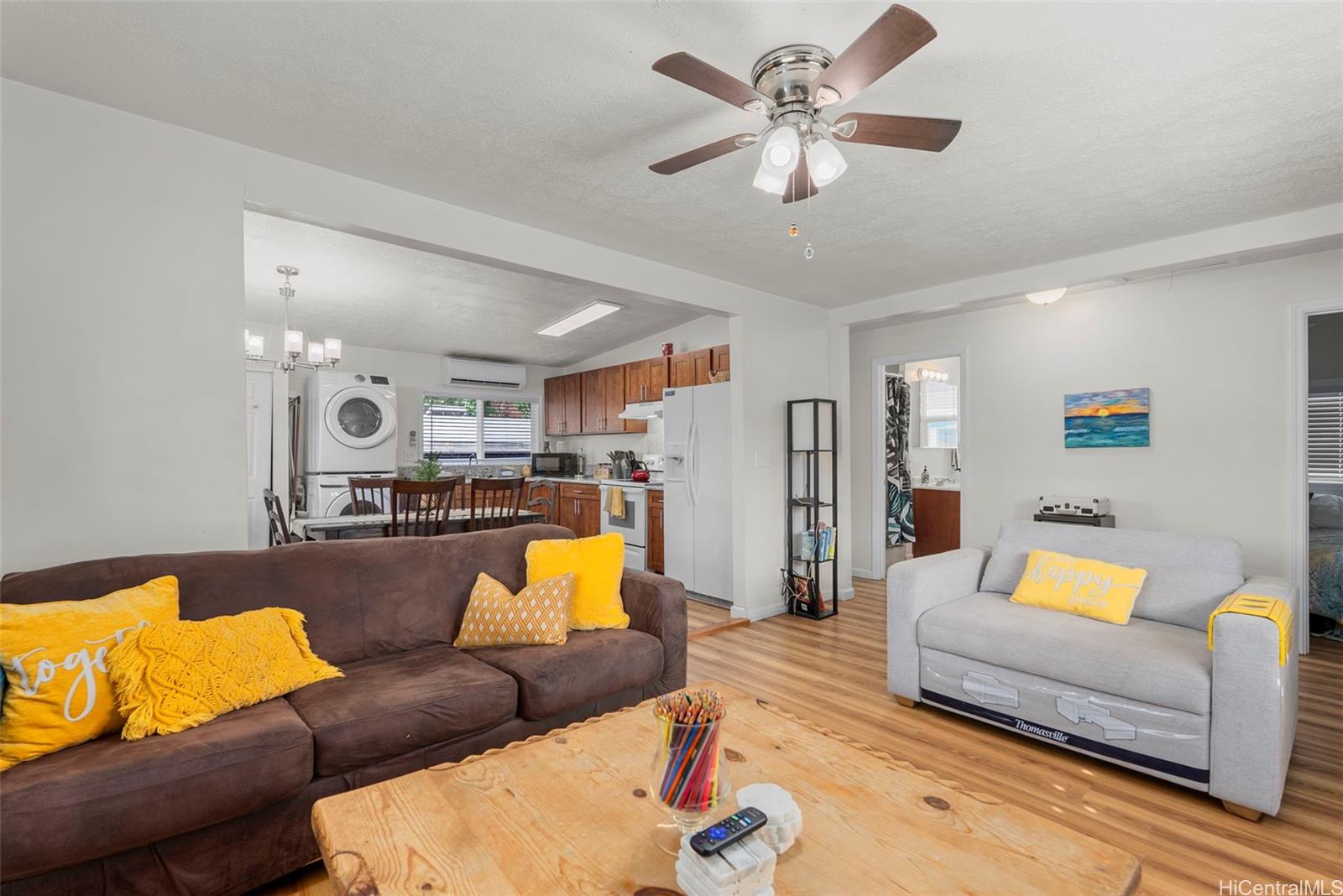 87-1423 Akowai Road Waianae, HI 96792 - Photo 6 of 24 a living room with furniture and kitchen view